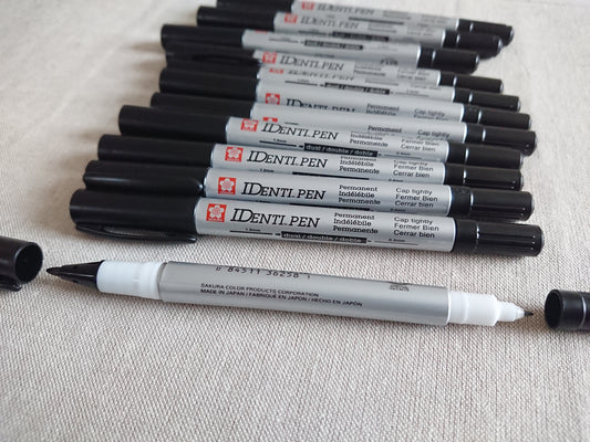 Merkisettið, límband og penni